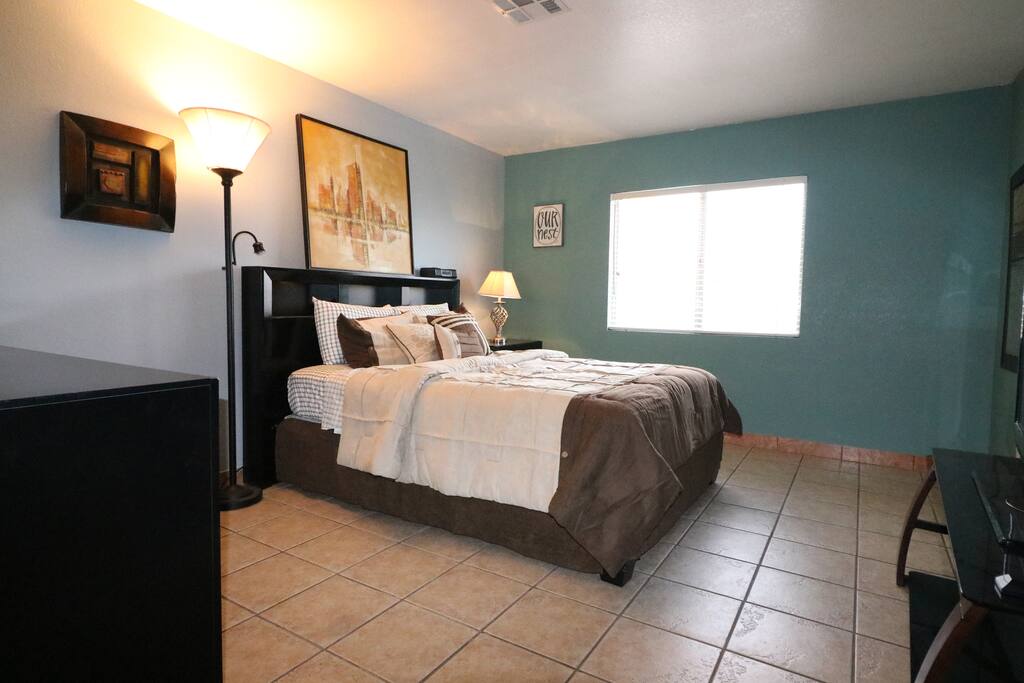 Spacious master bedroom with queen size bed