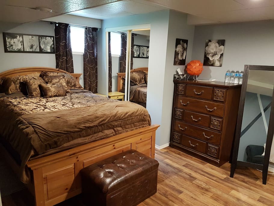 Private bedroom with brand new queen mattress, closet and dresser.