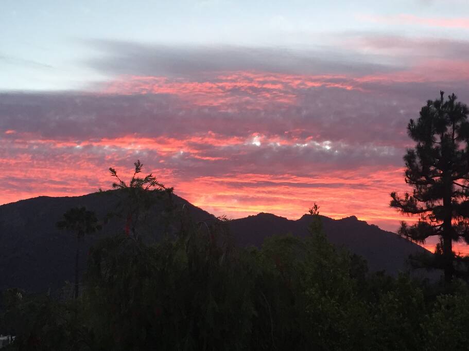 View of the mountains at sunset from the backyard