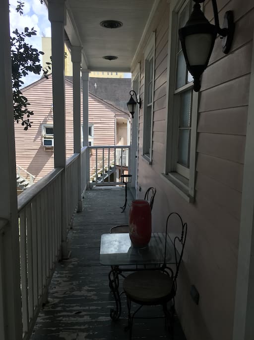 Shaded balcony offers cool breezes in summer , great for having morning coffee or a glass of wine after a long day of work or a wonderful day of festivities .