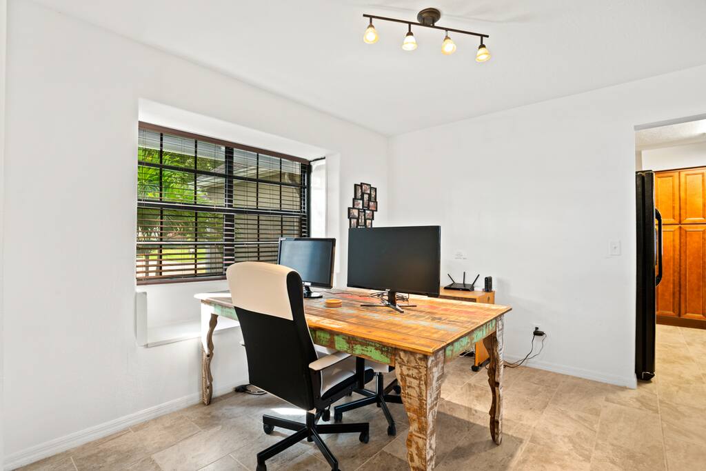 Dual monitor workstation with cushy desk chair (maybe nicer than your office) and lovely view out the window (definitely nicer than my office).