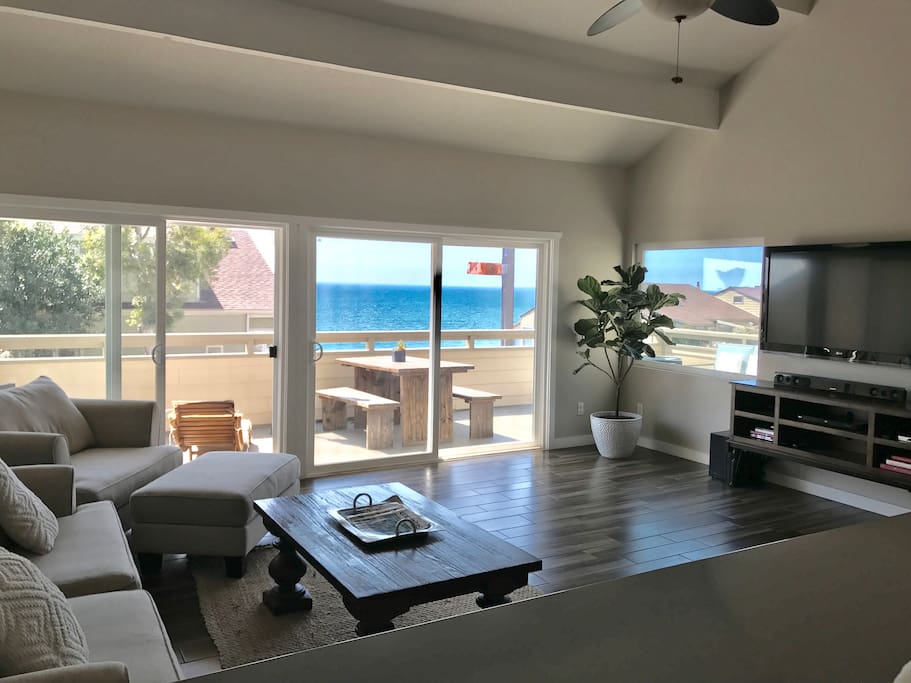 Second floor great room living room with ocean views, double glass sliding doors for maximum light and views. Roll down shades on exterior of sliding doors