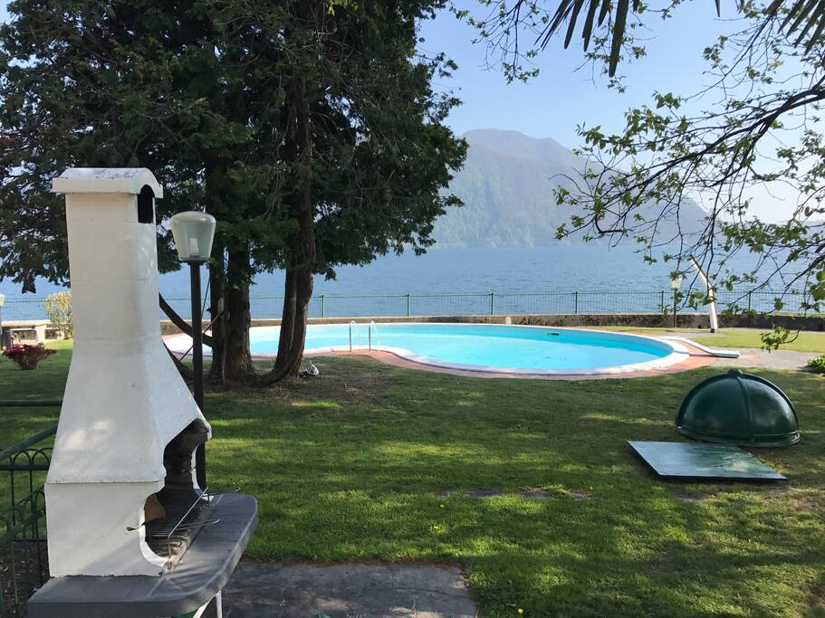 Swimmingpool and lake view from the barbecue
