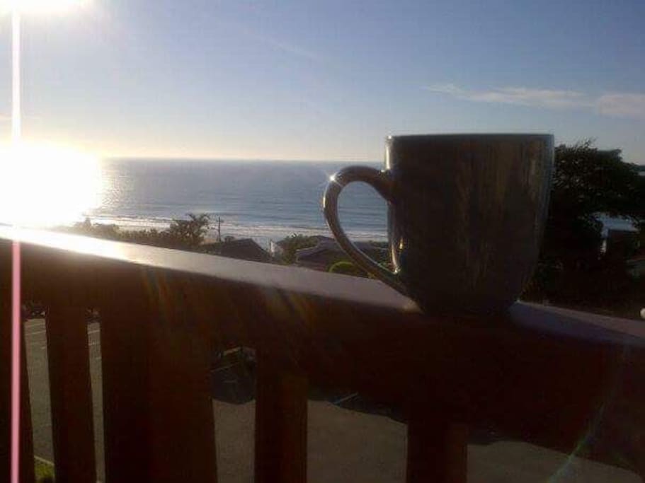 Have a coffee while you enjoy the sunrise over the ocean.