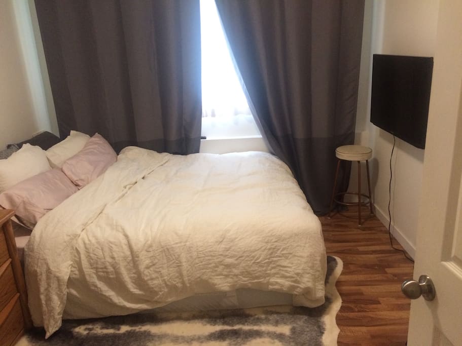 Comfy bedroom with plush new bed, 40" Smart TV with Netflix and blackout curtains