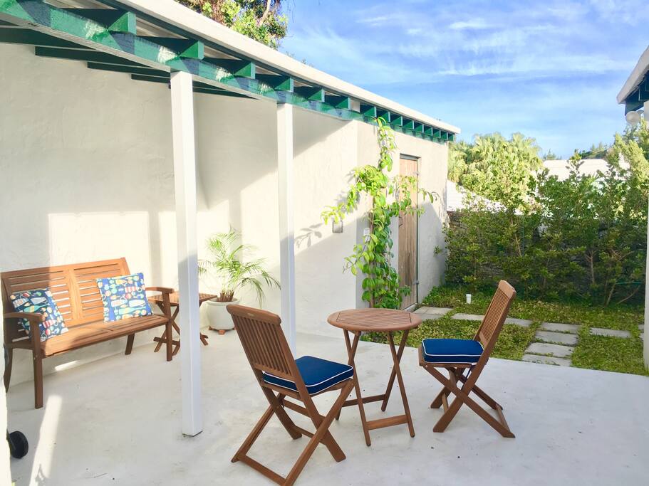 New wood furnishings and gas Weber grille on the private patio located at the back of the Cottage .