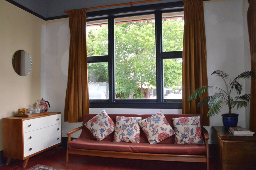 Your room has a comfy vintage sofa which converts to a bed for extra guests