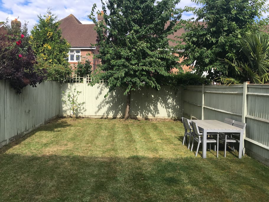 Sunny garden with table and chairs. BBQ available if required.