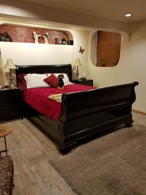 Master Queen Bed downstairs near the bathroom.