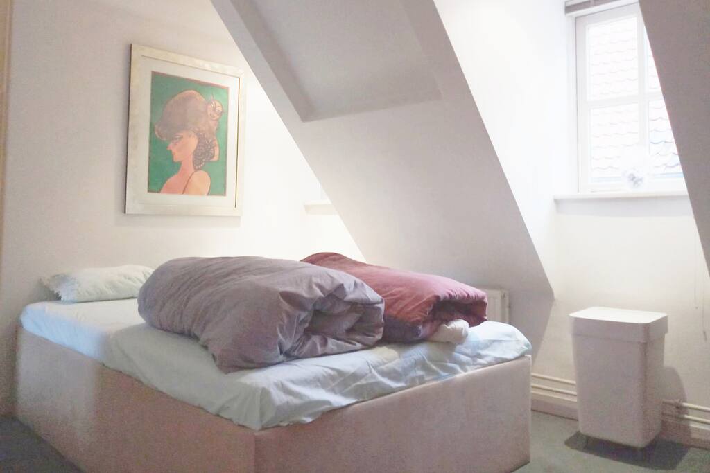 Another view of double bed with two blankets