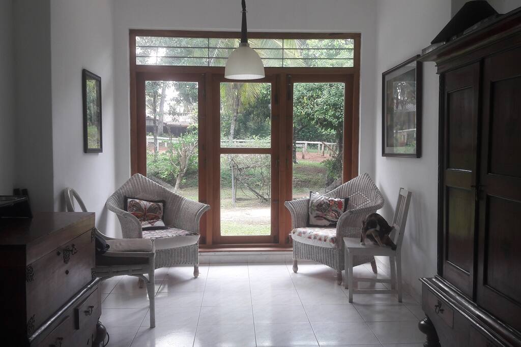 Living room with view over the gardens and stables