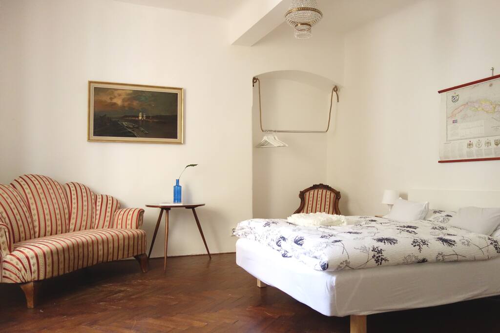 Welcome to your room. It is decorated in style of Biedermaier so you can experience what it's like to live as in 19th century. It's separated from the rest of the apartment by a corridor.