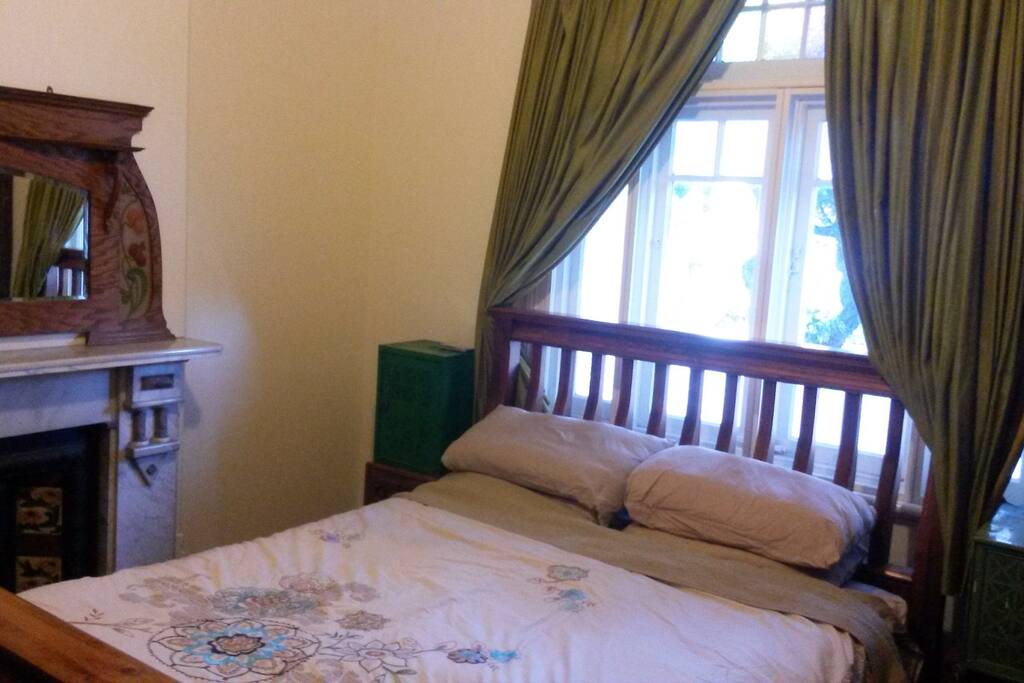 Master bedroom 1 queen sized bed. Fireplace and patterned ceiling