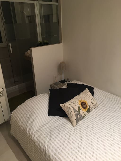 This is the guests’ room. There’s a double bed and private shower and toilet inside of the room. Also an empty closet