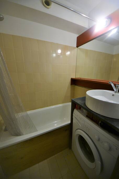 Bathroom with Shower/Bath, toilet, sink and washing machine