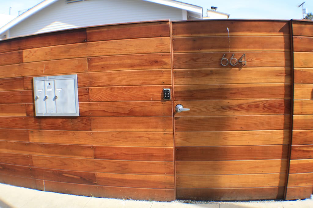 View of the front gate for the bungalow with automated keypad
