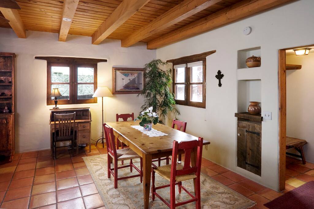 On the far side of the living room is a dining table for six.