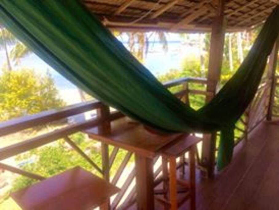 relax in the hammock with a book looking out over the ocean