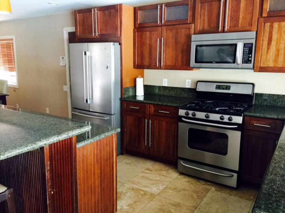 New kitchen with granite countertops and stainless appliances and dishwasher