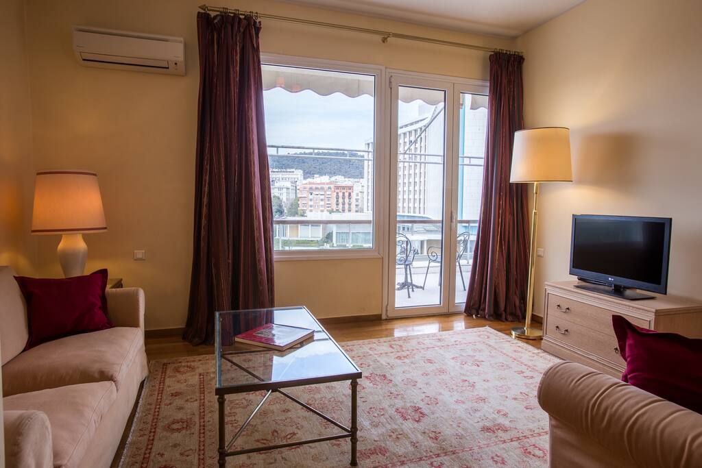 Spacious living room with direct access to private balcony with an amazing view!