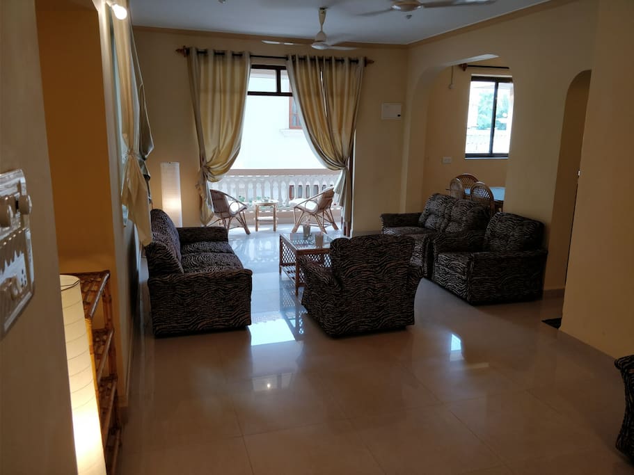 Sitting area, living room with attached balcony.
