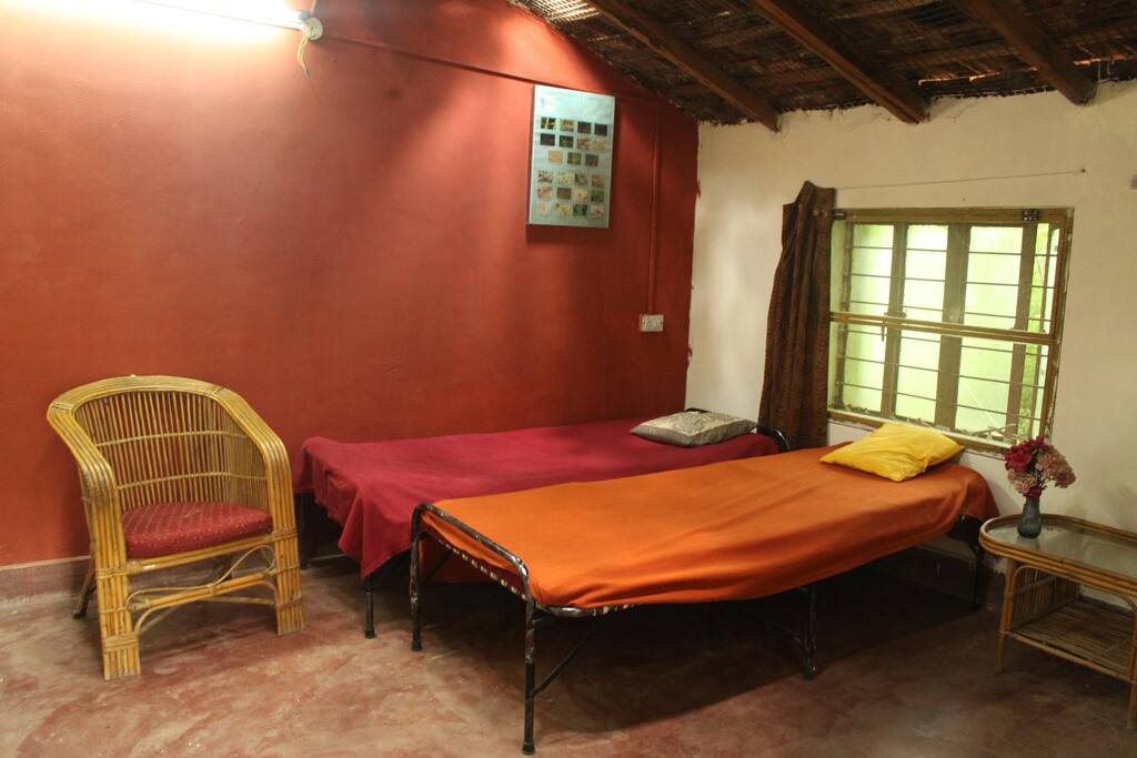Room 1 : Basic yet modern twin sharing room created in the local style of building decorated with a rural ambience. With titled roof lightings.