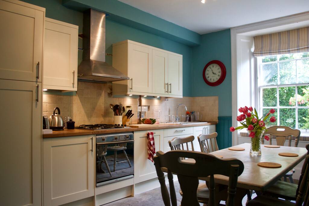 Kitchen table, units and view to garden