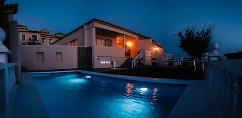 House with a pool and ocean views