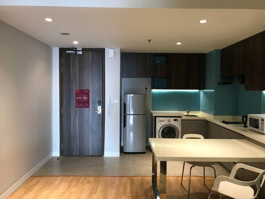 Kitchen with washer and dryer