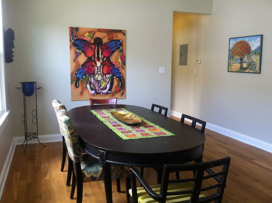 This table is in the dining room can be where you, your friends & family, can share meals together in this beautiful home which is steps away from Jazz Fest and only 2.4 miles from the French Quarter, Central Business District and Super Dome.