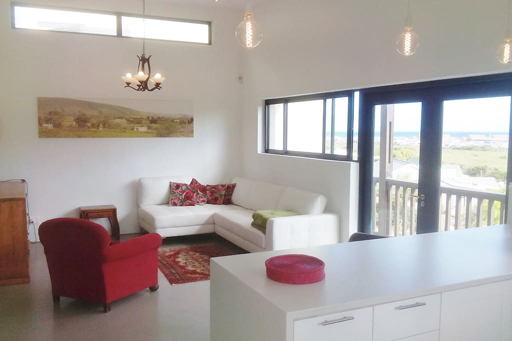 Open plan lounge has panoramic views over the valley and wetland, down to the Indian Ocean...