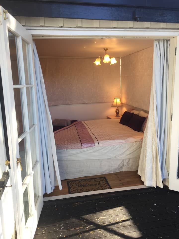 Bedroom 3  french doors  onto the deck 