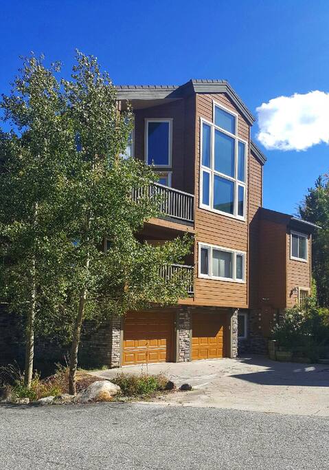 One garage space (on left) with two places to park in front of it. Top floor unit with vaulted ceilings!