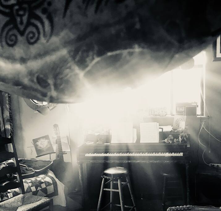 This is the music room - there is a bed in here as well and it can serve as a private bedroom. There is a piano to boot!