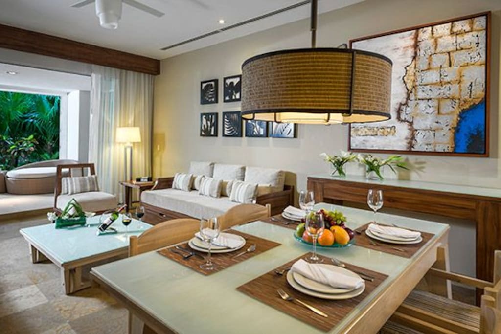 The interior of the Grand Master Suite is spacious and modern with warm natural colours, bright whites and fine wood tones and textures.