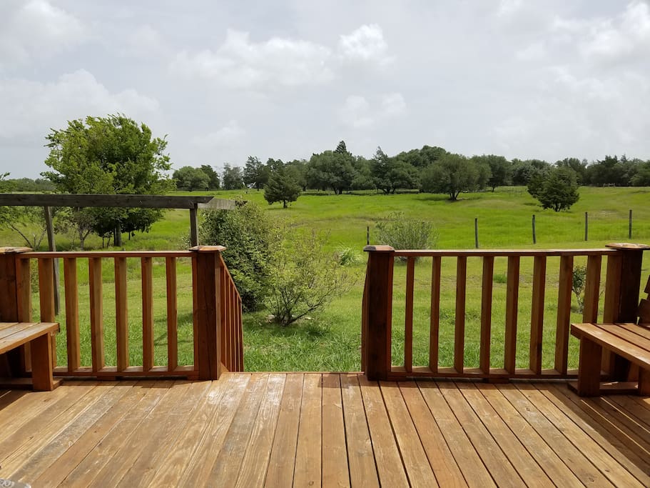 Deck looking out the back of the house. SO relaxing to sit on the back deck and watch the stars--you can see them without the city lights !