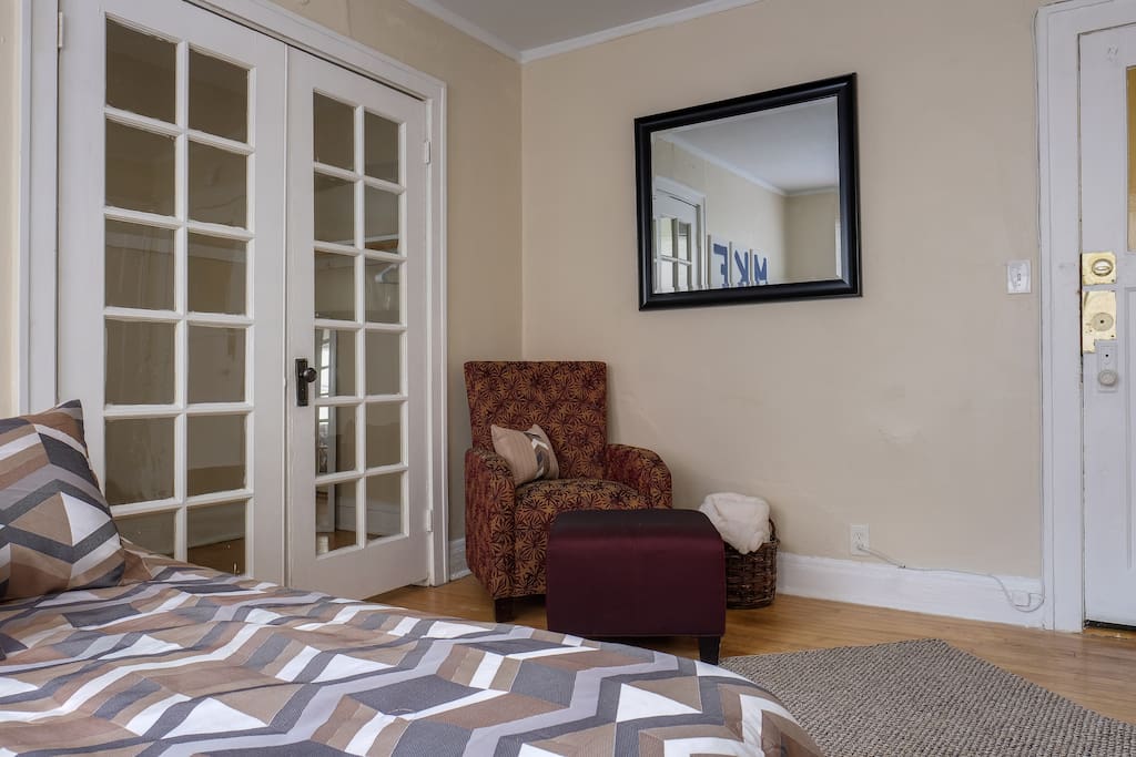 Queen size bed and chair for reading or watching TV