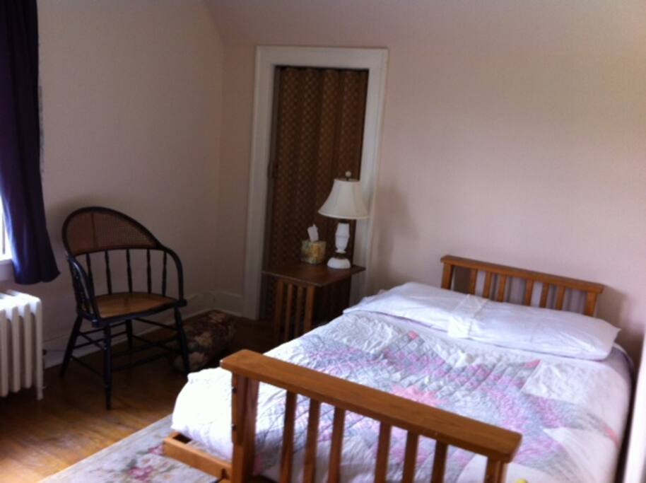 Futon and door to closet with mattress on floor