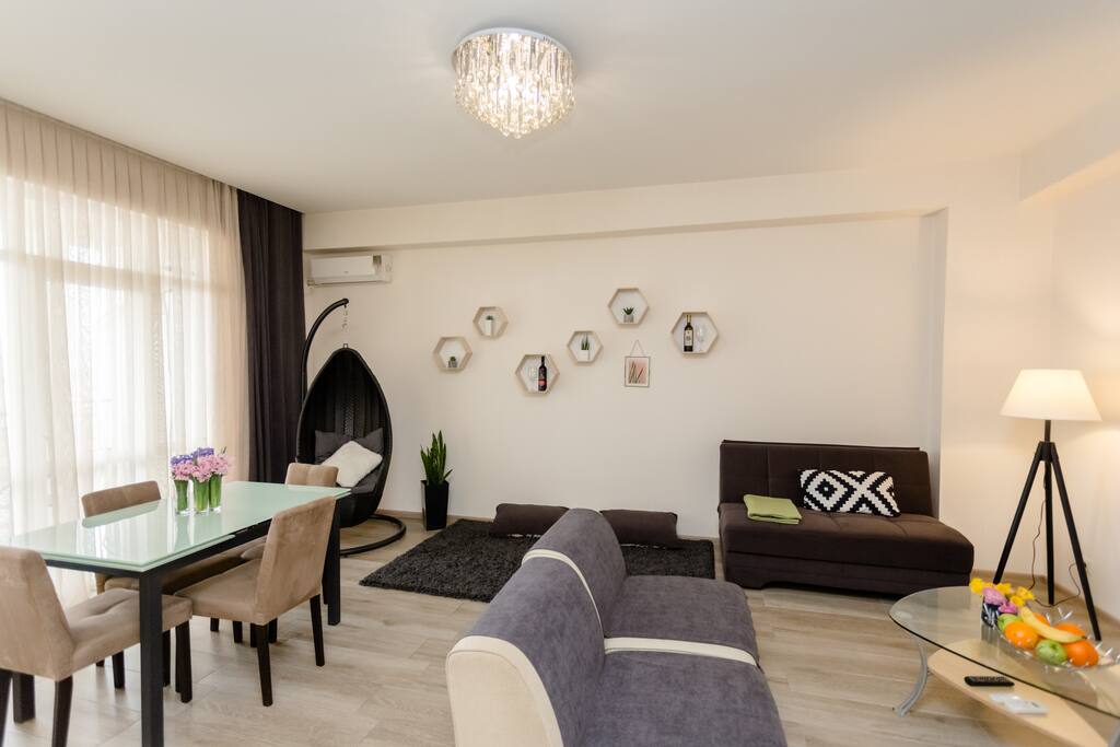 Modern style living room with plenty of natural light and a high-quality furniture