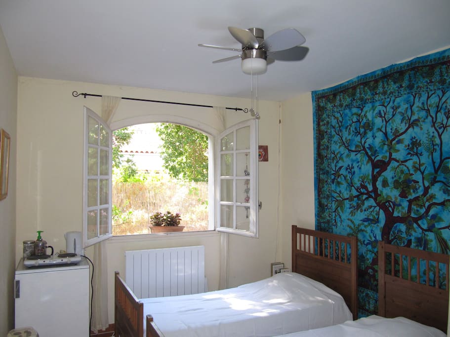 Bedroom with 2 comfortable single beds, fridge, kettle & 2 ring cooker.