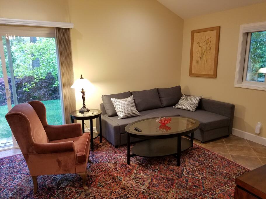 Couch unfolds into bed for two additional people.
