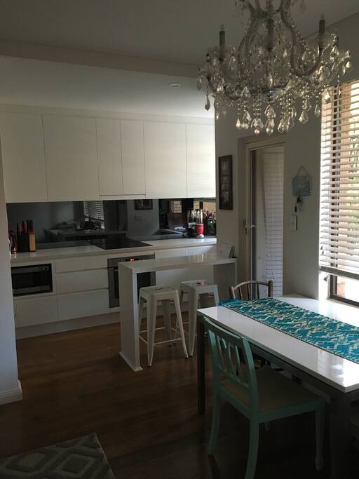 Wooden floors throughout except in bedroom.