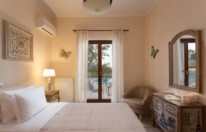 Villa Anastasia - Bedroom 2: Ground floor double master bedroom with en-suite bathroom on the pool side