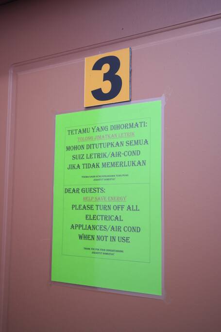 Twin bedroom with shared bathroom (2 single bed, aircond + fan).