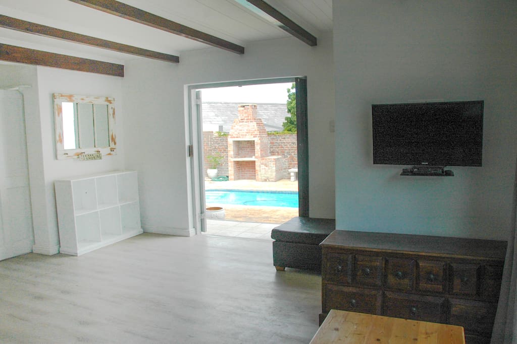 view of pool from living room couch