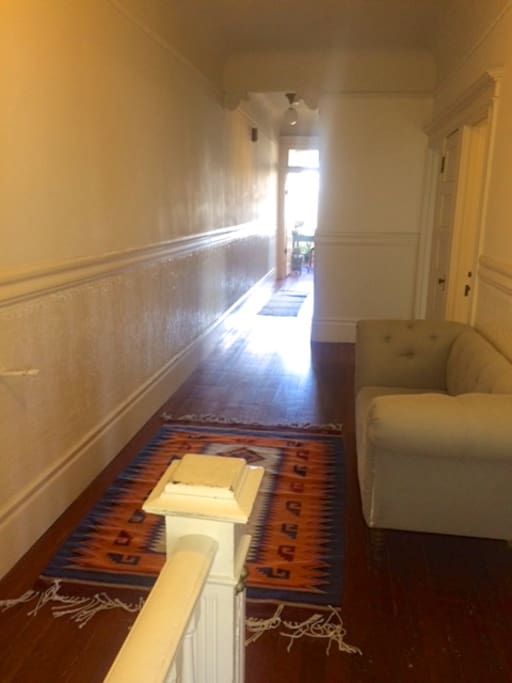 Entry way to long hallway which ensures privacy between suites