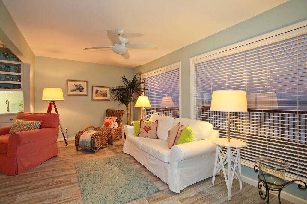 Main living room, view to private deck, reading nook.