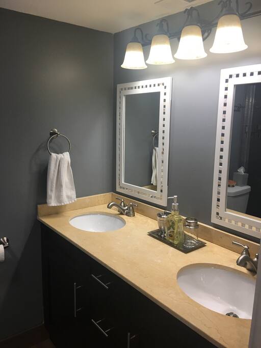 Master bathroom with double sink. Stand up shower with handicap bar (not pictured)