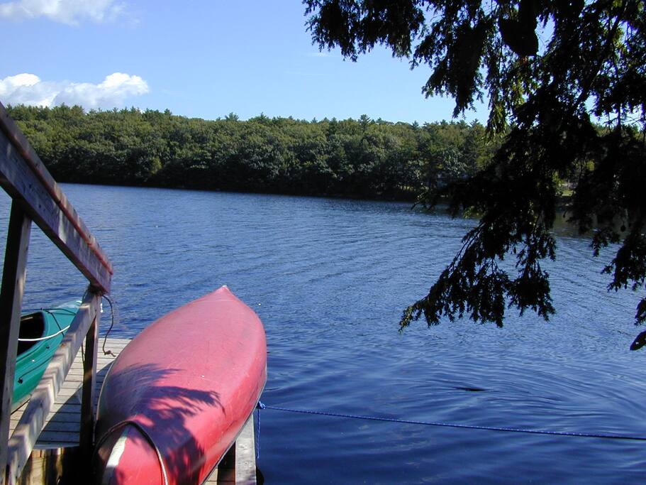 Old Town Canoe and large 2 person Kayak with paddles at the dock