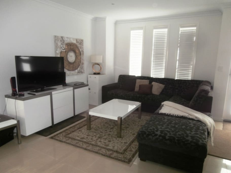 Comfortable modern lounge with 48" LCD TV & Great Sound system with DVD Player